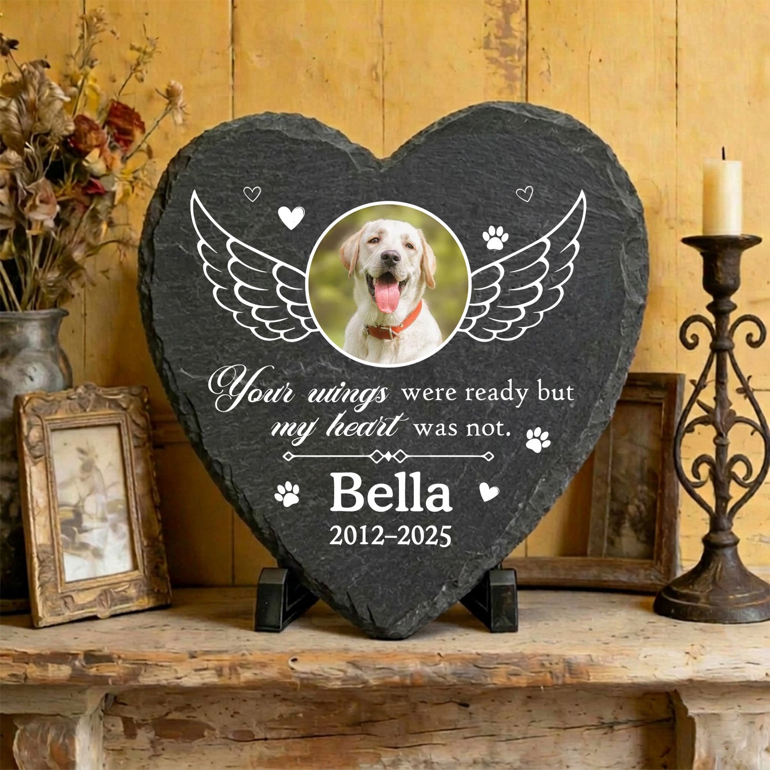 Heart personalized pet memorial stone with custom dog photo and angel wings illustration on textured natural slate.