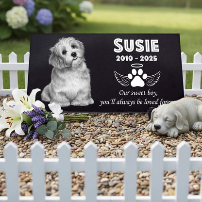 Handcrafted granite dog memorial stone with custom paw prints